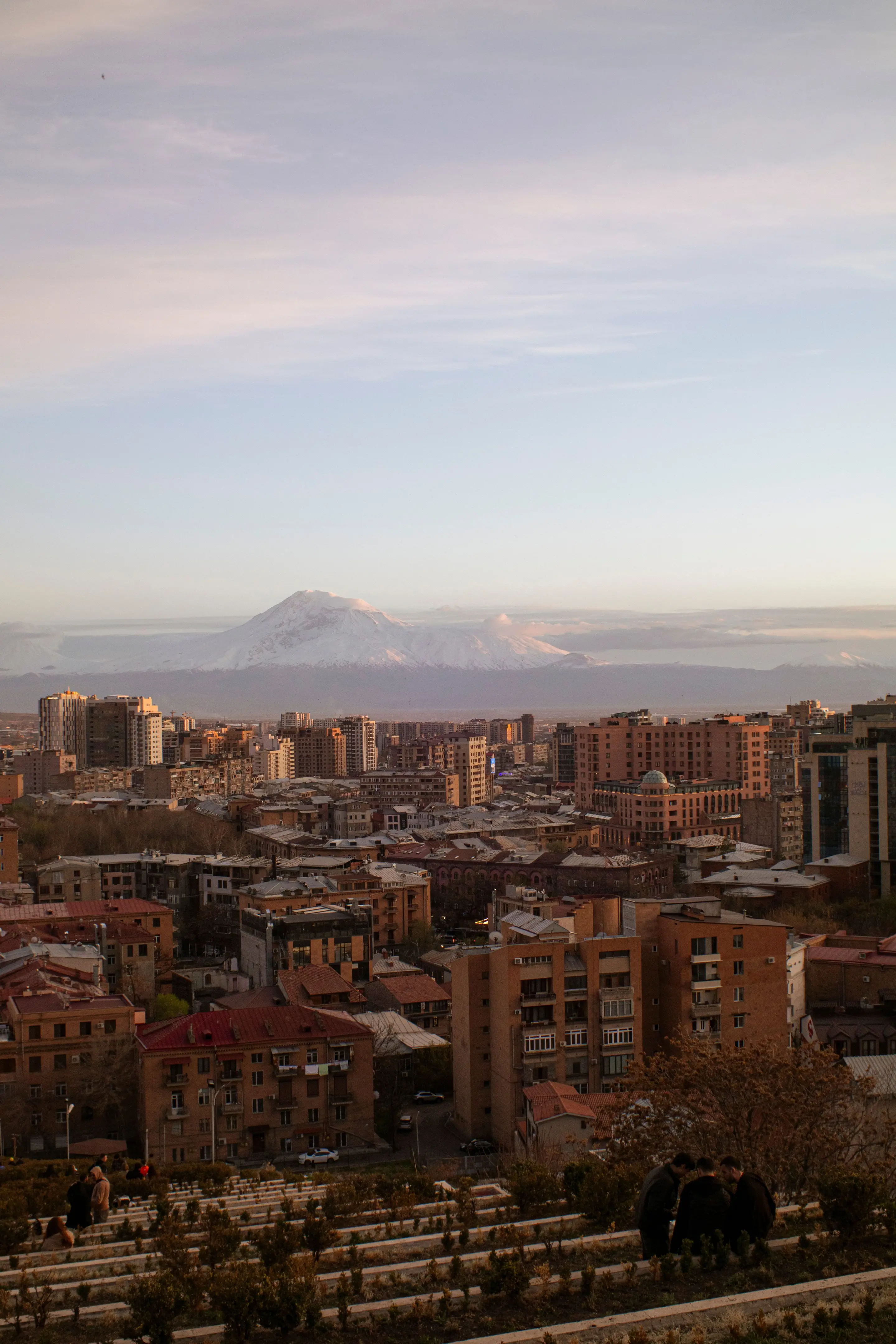 Yerevan at dusk seen from the Cascade steps with Mount Ararat behind the city